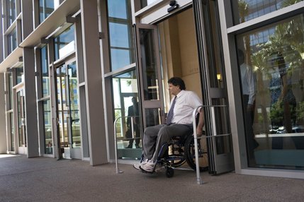 Tom Urbanski exits the Regional Justice Center after testifying in a grand jury investigation into the 2007 Minxx strip club shooting that left him paralyzed.