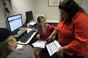 CSN student Brittany Hentzell, 20, seated, talks with site coordinator April Krell at the Moapa Valley center. Hentzell plans to finish an associate degree this fall. She said she might not have started college had CSN not had its campus in Logandale. 