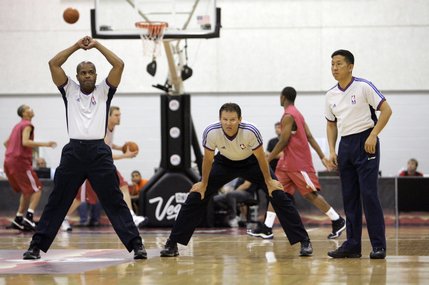 Officials stretch out as they prepare for a NBA Summer League game  between New York Knicks and Cleveland Cavaliers at the Cox Pavilion in Las Vegas on Monday July 14.