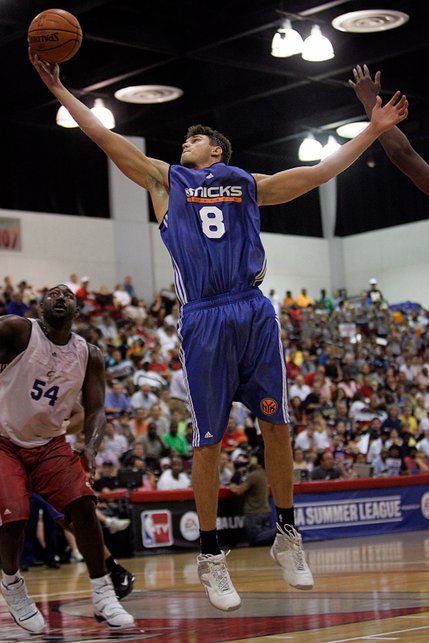 Danilo Gallinari, center, of the New York Knicks pulls down a rebound over Cleveland Cavaliers' Robert Traylor during a NBA Summer League game Monday, July 14, at the COX Pavilion in Las Vegas. Gallinari, the sixth overall pick, scored 14 points in his pro debut as New York won, 97-94.