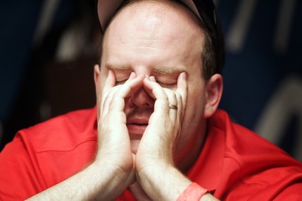 Joe Bishop shows his exhaustion during the final two tables of the WSOP World Championship No Limit Texas Hold 'em event. Bishop was knocked out at 11th place with total winnings of $591,869.