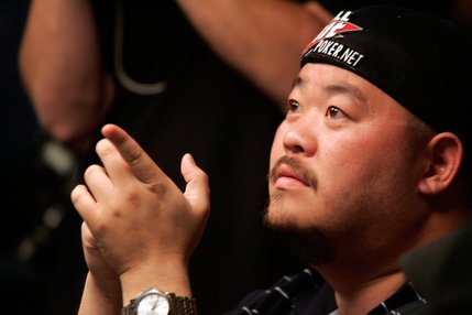 Kelly Kim gestures to his friends in the crowd while playing in one of the two final tables of the WSOP World Championship No Limit Texas Hold 'em event. Kim will return as one of the 