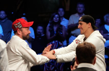 Judet Toni Christian, right, shakes hands with Dennis Phillips after Christian was eliminated at 23rd place and won $257,334 in the WSOP World Championship No Limit Texas Hold 'em event. Phillips has the chip lead of the final nine players and will resume play with a chip count of 26,295,000 November 9.