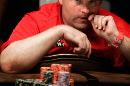 Joe Bishop bites his nails while contemplating a move at one of the two final tables of the WSOP World Championship No Limit Texas Hold 'em event. 