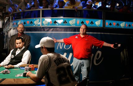 Joe Bishop, right, exclaims he will go all in against Chris Klodnicki, center seated, during the last hand before a dinner break at the WSOP World Championship No Limit Texas Hold 'em event. Both Bishop and Klodnicki were knocked out before the final table was determined, early the next morning.