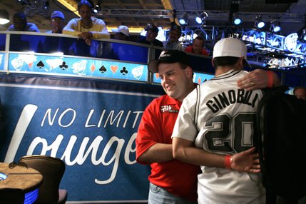 Joe Bishop hugs Chris Klodnicki after Klodnicki folds during the last hand before a dinner break at the WSOP World Championship No Limit Texas Hold 'em event. Both Bishop and Klodnicki were knocked out before the final table was determined, early the next morning.