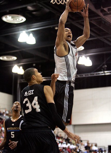 Portland Trailblazers' Jerryd Bayless goes up for a basket against Washington Wizards' JaVale McGee (formerly of the University of Nevada) during a NBA Summer League game Monday, July 14, at the COX Pavilion in Las Vegas.