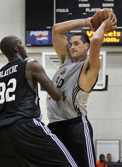 Former Mountain West standout Josh Davis is covered by Andray Blatche during a Summer League game Monday at Cox Pavilion between teams representing Washington and Portland. 