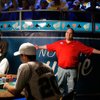 Joe Bishop, right, exclaims that he's going all in Monday against Chris Klodnicki, center, during th