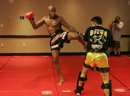 Anderson Silva kicks sparring partner Daniel Woirin during a workout before his light heavyweight fight against James Irvin at the Palms on Saturday .