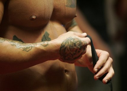 James Irvin unwraps his hands after a media workout Thursday, July 17.