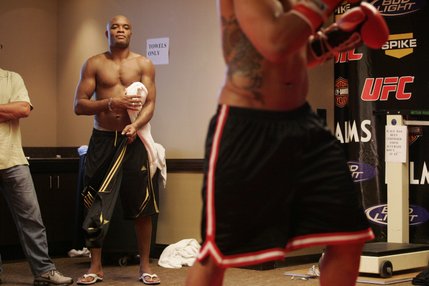 After his workout, Anderson Silva watches sparring partner Rafael Custodio  get his own workout. 