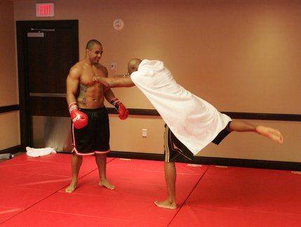After his workout, Anderson Silva pretends to be Superman and attacks sparring partner Rafael Custodio. 