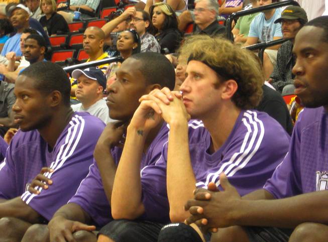Matt Walsh of the Sacramento Kings, second from right, watches from the bench as his team plays in Cox Pavilion in NBA summer league action. Walsh, who left the University of Florida a year early, has bounced around the pro ranks in Europe since being cut by the Miami Heat in 2005. His goal this week was to hopefully catch the eye of an NBA general manager so that he can work his way back into the league, but playing his time was minimal.