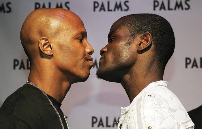 Welterweight boxers Zab Judah, left, and Joseph Clottey face off during a news conference.