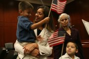 Maria Elizabeth Parra-Hernandez, 25, is a juvenile services assistant for Clark County, helping youths who have broken the law meet the terms of their probation. Her 3-year-old son, Julian, her mother, Eva Parra, and her 5-year-old brother, Angel Parra-Sandoval, joined her at her naturalization ceremony July 25 at the federal courthouse.