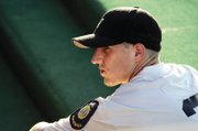 Las Vegas Post 40 pitcher-outfielder Alex Steward, sitting in the dugout during Saturday's game, sports the embroidered shoulder patch that long has identified American Legion ballplayers.