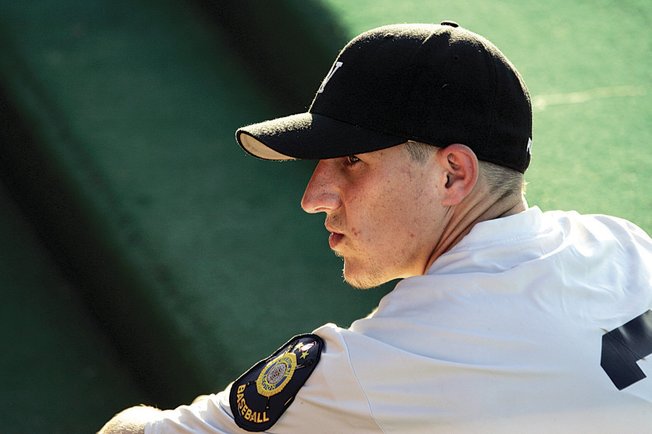Las Vegas Post 40 pitcher-outfielder Alex Steward, sitting in the dugout during Saturday's game, sports the embroidered shoulder patch that long has identified American Legion ballplayers.