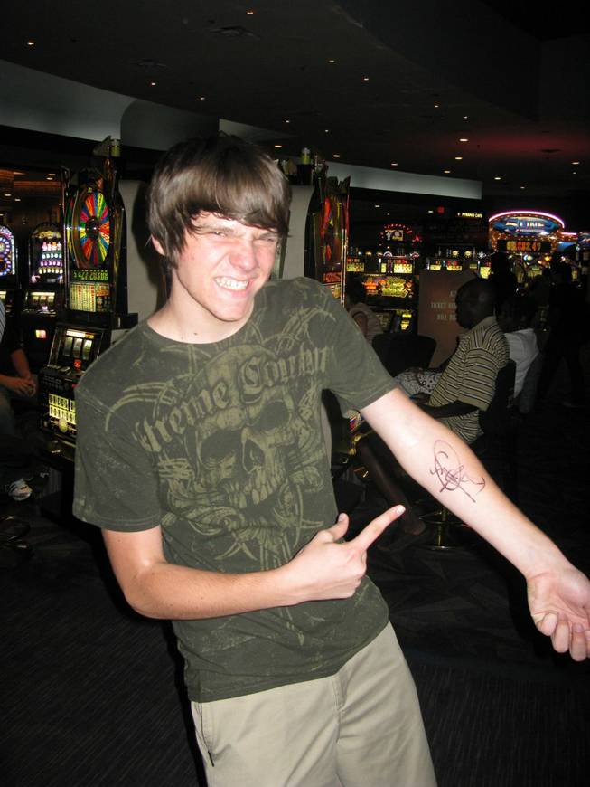Criss Angel fan and fellow illusionist, Jacob Wilson, shows off his autographed arm after meeting the inspirational mindfreak Wednesday night. Wilson, 15, traveled from Visalia, Calif., to meet Angel and audition for the Believe video. 