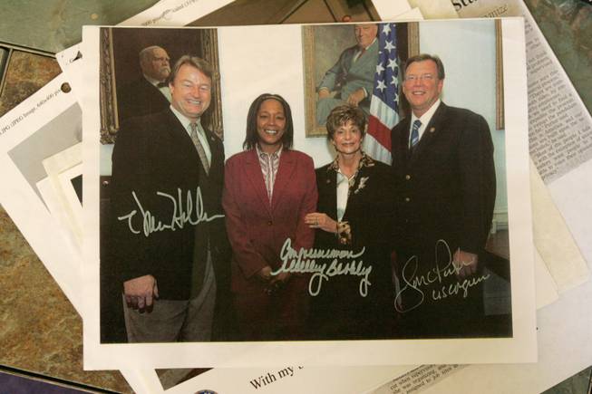 Anishya Sanders, second from left,  poses in this signed photo with, from left, Reps. Dean Heller, Shelley Berkley and Jon Porter, all of Nevada.