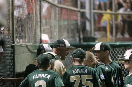 Paseo Verde All-Stars coach Tim McCollum talks to his players before their final inning against  Waipiio, Hawaii in the western regional championship game of the Little League World Series Sunday.