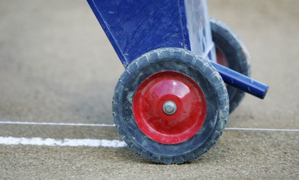 A groundskeeper chalks the foul line before the Paseo Verde All-Stars game against Waipio, Hawaii, in the western regional championship game of the Little League World Series Sunday.