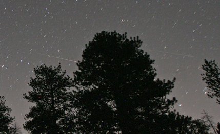 A Perseid meteor streaks toward the horizon early this morning. This photo was taken at Mount Charleston.