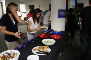 Volunteers at the Dina Titus party take a break for some food at the snack table. Titus is Democratic candidate for the 3rd Congressional District.