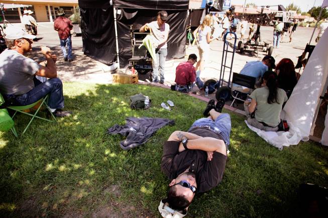 "This is the best job in the world," Drew Dixon says as he lays back in the grass on the set of the television show "Easy Money," filming in Albuquerque. Dixon is a stand-in for actor Jay R. Ferguson, who plays Cooper Buffkin in the series. A stand-in is someone who literally stands for the actor during the composition and lighting setup of the shots. There is a lot of "hurry up and wait" associated with this job, hence the down time. Stand-ins also get paid more than extras, hence Dixon's job satisfaction. - Leila Navidi