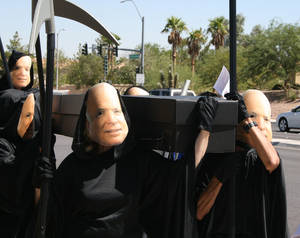 Sen. John McCain protesters held a mock funeral Wednesday for Nevada's foreclosed homes. The reapers were from the group Change to Win and are on a 10-state tour of dramatic protests in a campaign to reveal their grievances against a McCain presidency.  