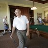 Hank Gulland, left, rear, chuckles as Norman DeSellem reacts to missing the eight ball while playing pool at the Sun City Aliante clubhouse.
