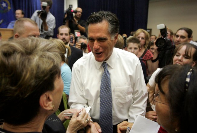 Mitt Romney visits with voters after he speaking to a crowded room of supporters at the Henderson Convention Center on Wednesday.