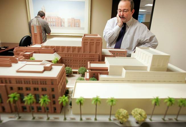 Myron Martin, president of the Las Vegas Performing Arts Center Foundation, looks over a model of the $475 million Smith Center. It won't be completed until the end of 2011, but a preview center will soon be open to the public. 