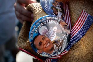 A Nevada delegate holds his hat at Mile HIgh Stadium in downtown Denver Thursday before Barack Obama's acceptance speech.