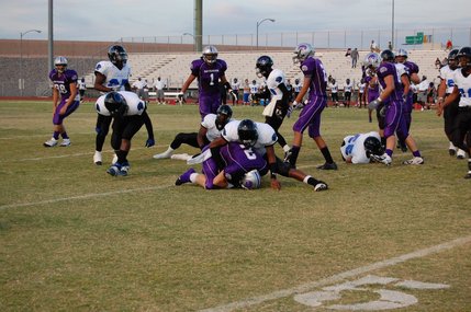A Jaguar tackles senior wide receiver Michael Wadsworth during the first quarter on Friday night. 