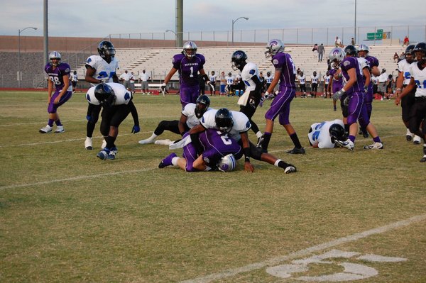 A Jaguar tackles senior wide receiver Michael Wadsworth during the ...