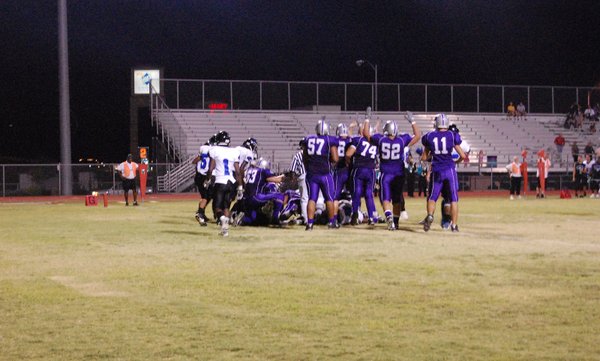 The Skyhawks celebrate after their first touchdown against the Jaguars. ...