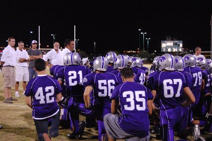 The Skyhawks listen to a talk from head coach Andy Ostolaza after their first win of the season on Friday night. Silverado shut out Desert Pines, 28-0.