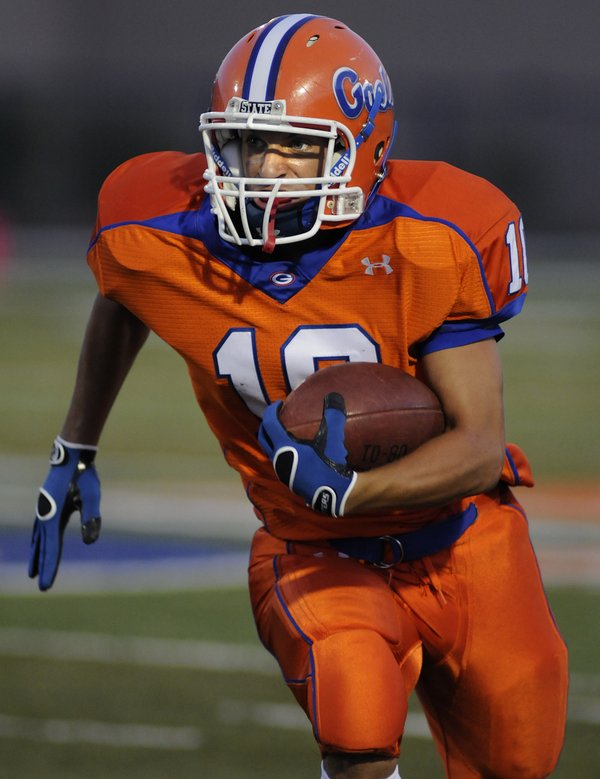 Bishop Gorman's Joe Huber looks up the field as he ...