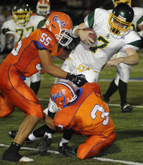 Bishop Gorman linebacker No. 55 Evan Palelei and defensive back ...