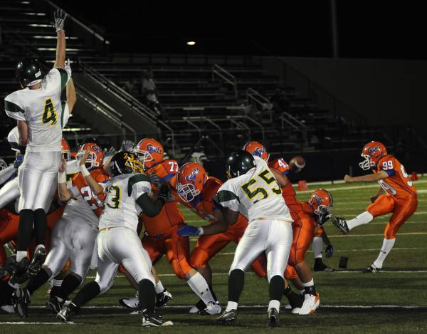 Gaels kicker No. 99 Colin Ditsworth, right, makes an extra ...