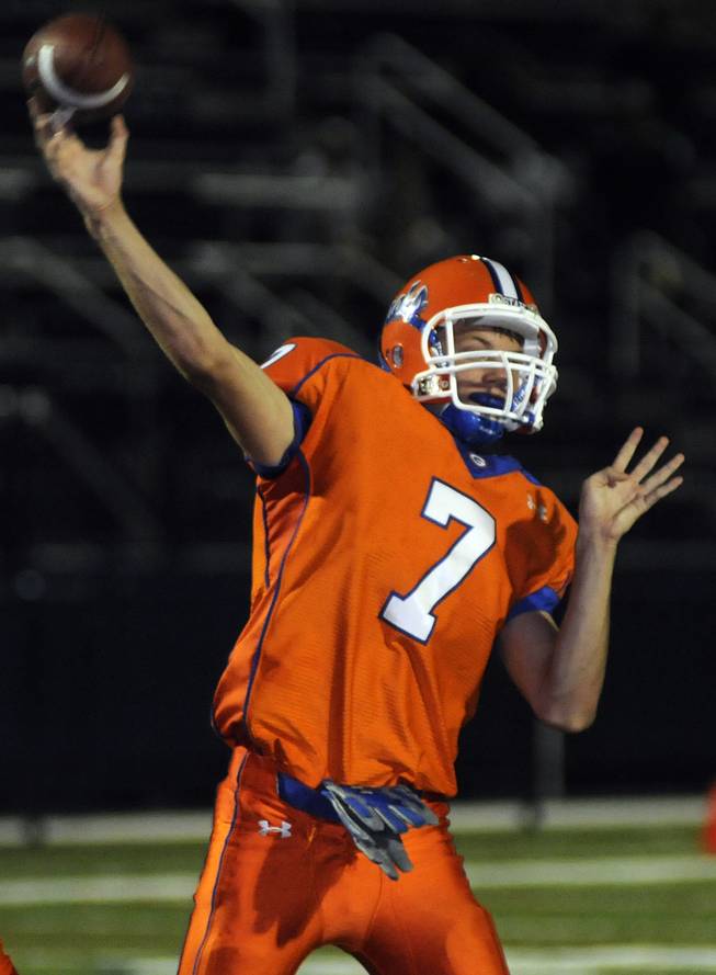 Bishop Gorman quarterback John Therrell throws a third-quarter touchdown pass to receiver Charles Childers during the Gaels' home opener against the Service High Cougars on Aug. 29.