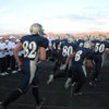 The Foothill High School Falcons rush the field for their first home game of the season on Friday. The Falcons hosted the Fountain Valley High School Barons, from Fountain Valley, Calif.