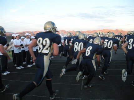 The Foothill High School Falcons rush the field for their first home game of the season on Friday. The Falcons hosted the Fountain Valley High School Barons, from Fountain Valley, Calif.