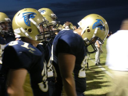 Linebacker No. 24 Charles Fisher bows his head after the Barons score another touchdown during the second quarter.