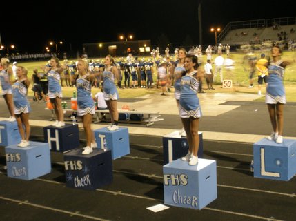 Foothill High School cheerleaders celebrate another Falcon touchdown.