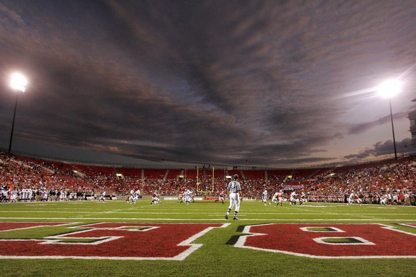 A cloudy sky is lit by the setting sun as ...