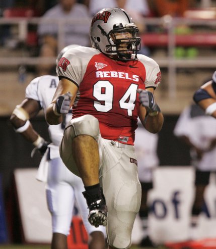 UNLV defensive lineman Thor Pili celebrates stopping Utah State at the goal line during the second quarter Saturday at Sam Boyd Stadium.
