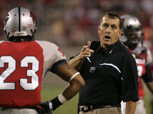 UNLV coach Mike Sanford talks to his players during the ...