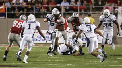 UNLV quarterback Mike Clausen looks for some running room during the second quarter against Utah State at Sam Boyd Stadium.